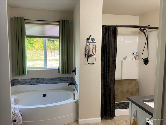 bathroom with shower with separate bathtub and vanity