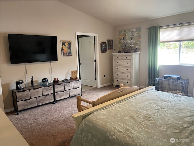 bedroom with carpet flooring and lofted ceiling