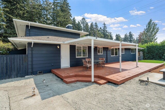 view of front of property featuring a wooden deck