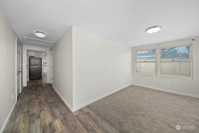 hall with dark hardwood / wood-style flooring