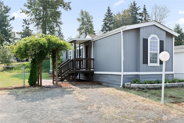 view of home's exterior featuring a yard and fence