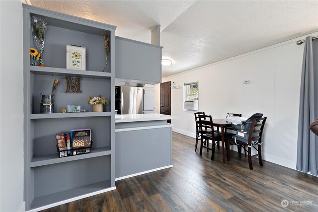 13708 108th Street Ct E Unit 4, Puyallup, WA 98374 - kitchen featuring built in shelves, dark wood finished floors, freestanding refrigerator, light countertops, and a textured ceiling