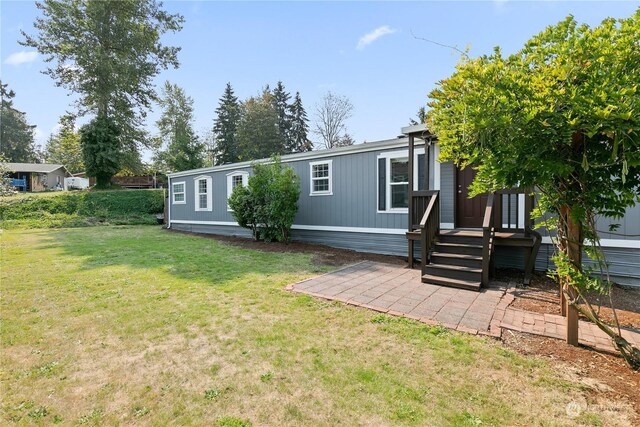 13708 108th Street Ct E Unit 4, Puyallup, WA 98374 - view of front of property featuring a front yard and a patio