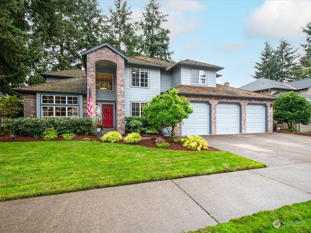 view of front property featuring a front yard and a garage