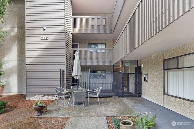 exterior space with a patio area and a balcony