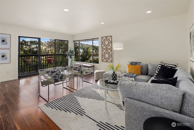 living room with recessed lighting, wood finished floors, and baseboards