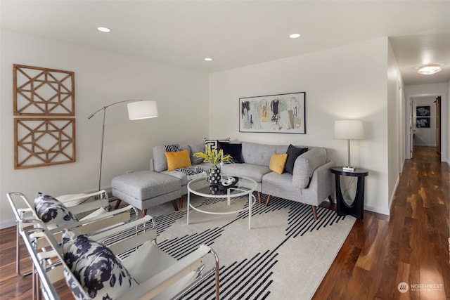 living area with recessed lighting, baseboards, and wood finished floors