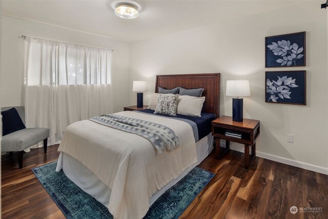 bedroom featuring dark hardwood / wood-style floors