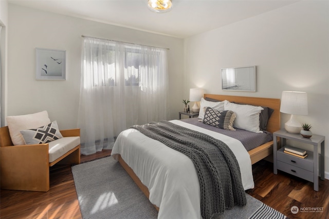 bedroom featuring wood finished floors