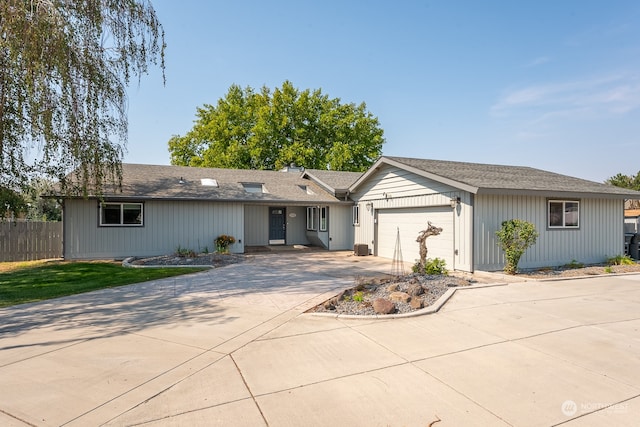 ranch-style house featuring a garage