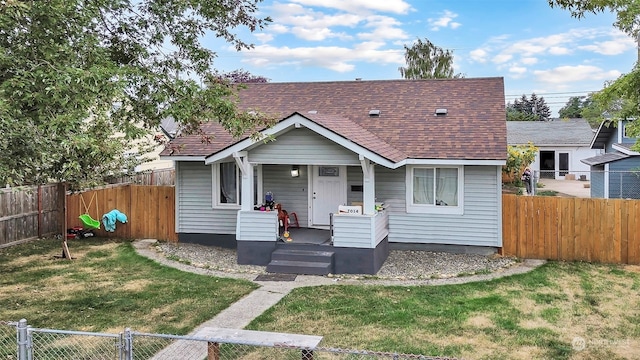 bungalow-style home with covered porch and a front lawn