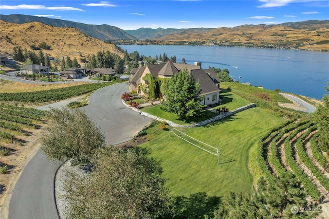 bird's eye view with a water and mountain view