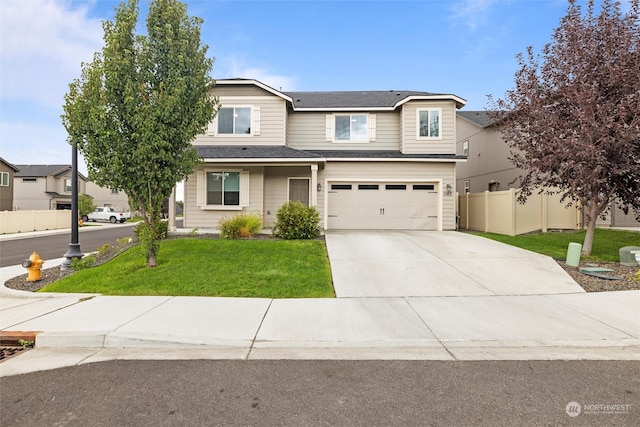 view of front of home featuring a front lawn and a garage