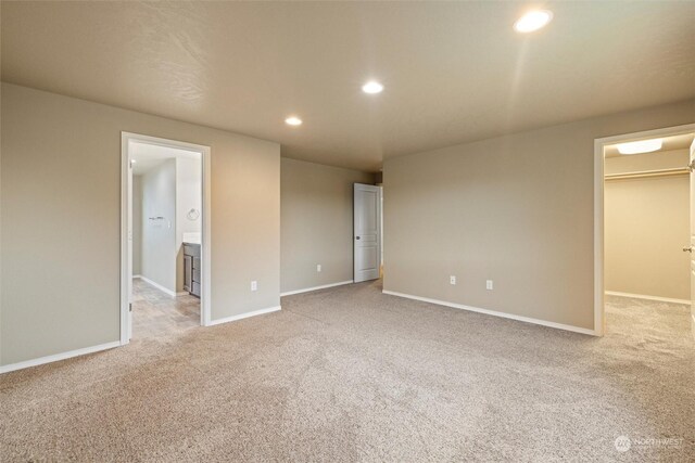 empty room featuring light carpet