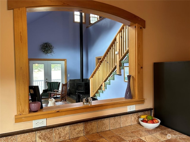 2407 Oysterville Rd, Oysterville, WA 98641 - staircase featuring french doors, a wood stove, and arched walkways