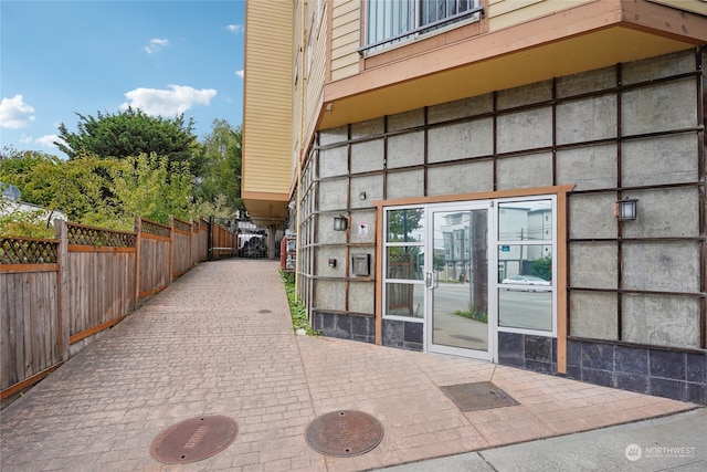 view of side of home with a patio area