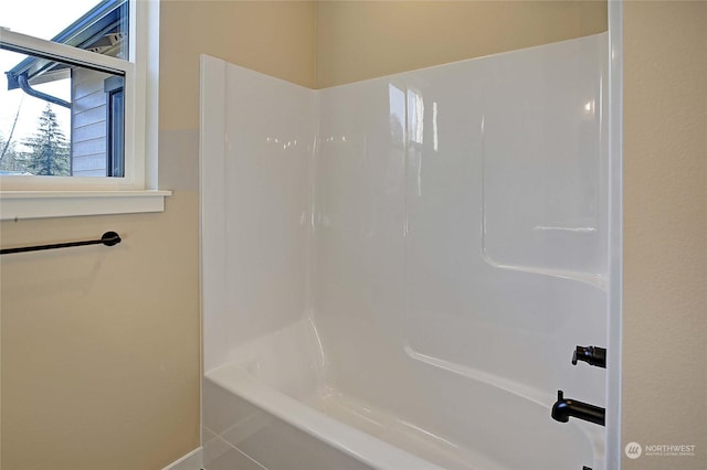 bathroom featuring  shower combination