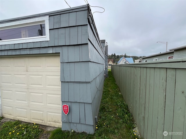 view of property exterior featuring a garage