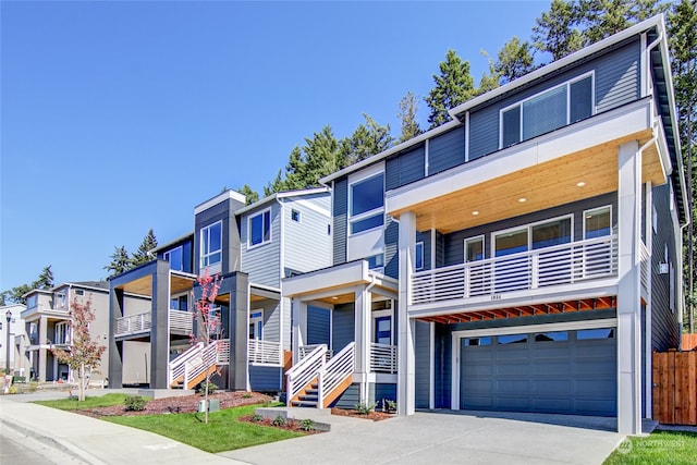 view of front of property with a balcony and a garage