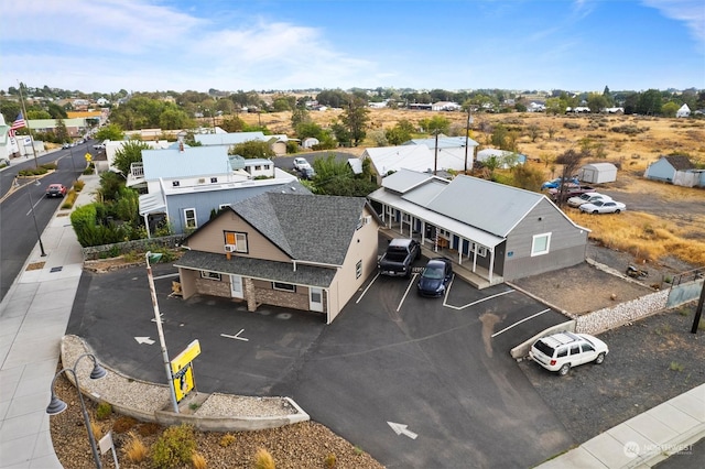 birds eye view of property with a residential view