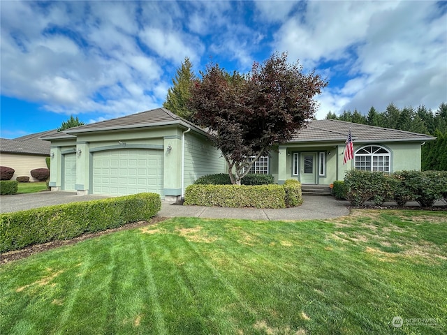 single story home with a garage and a front yard