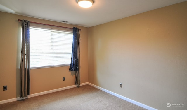 unfurnished room with carpet flooring