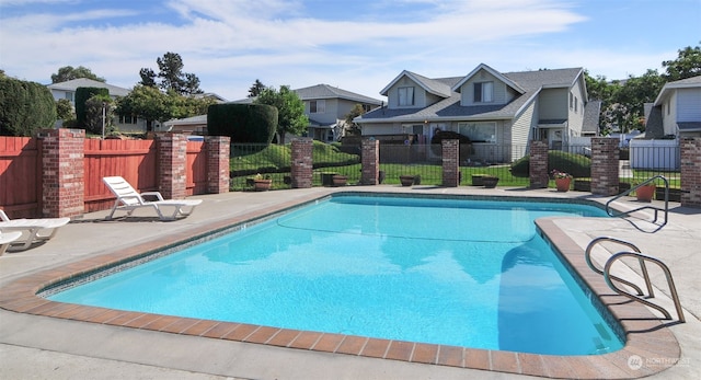 view of swimming pool featuring a patio area