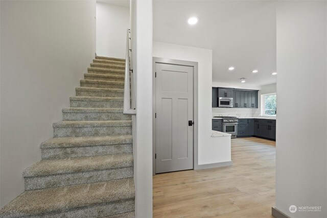 staircase featuring hardwood / wood-style floors