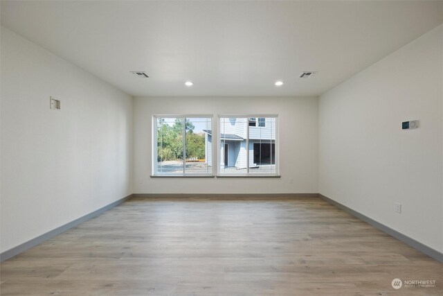 unfurnished room featuring light wood-type flooring