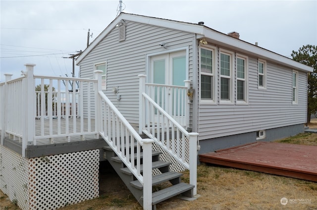 view of side of property featuring a deck