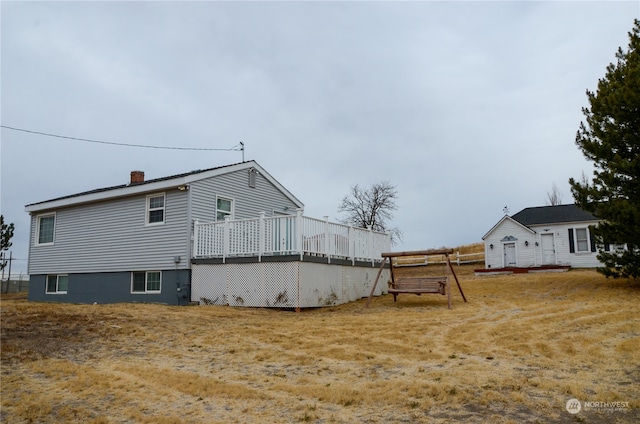 exterior space featuring a wooden deck