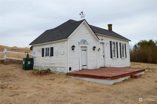 view of front of home with a wooden deck