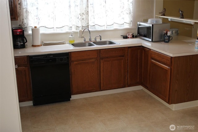 403 S Alder St, Odessa, WA 99159 - kitchen featuring black dishwasher, stainless steel microwave, a sink, and healthy amount of natural light