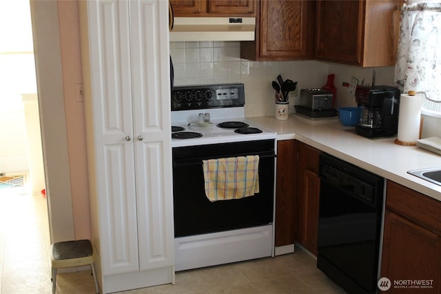 403 S Alder St, Odessa, WA 99159 - kitchen with electric range, under cabinet range hood, black dishwasher, light countertops, and decorative backsplash