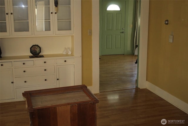 403 S Alder St, Odessa, WA 99159 - corridor featuring dark wood-style flooring and baseboards
