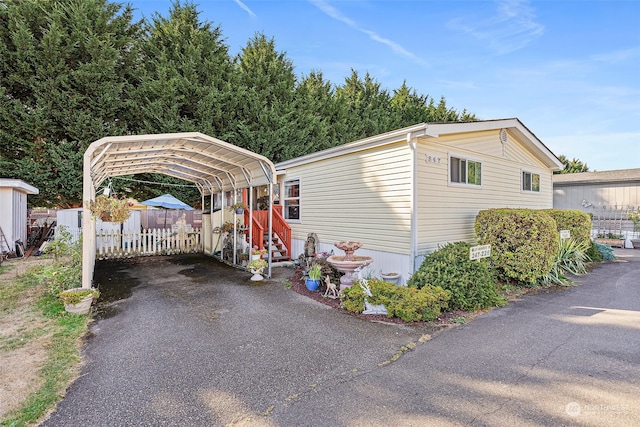 view of front facade with a carport