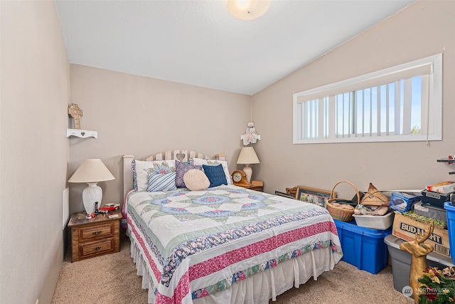 carpeted bedroom featuring vaulted ceiling