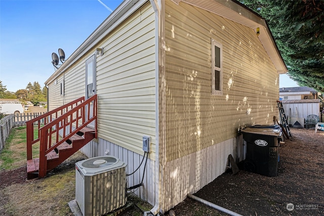 view of home's exterior with cooling unit