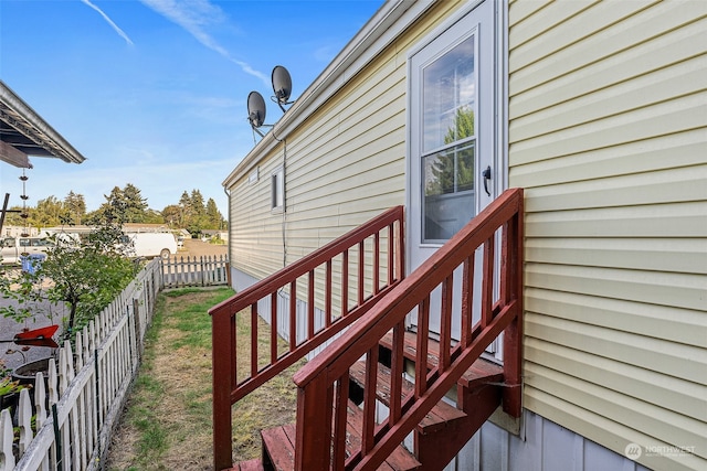 view of property exterior featuring a deck