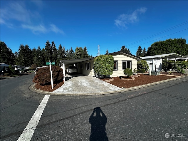 view of front of home with a carport