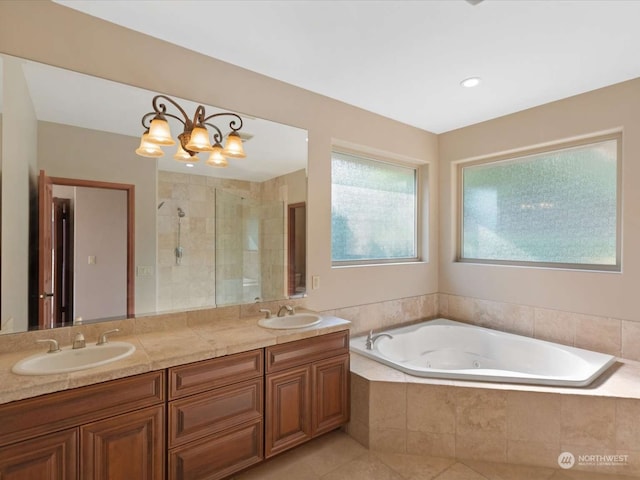 bathroom featuring vanity, tile patterned floors, and shower with separate bathtub