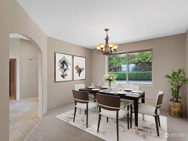 dining area featuring a notable chandelier