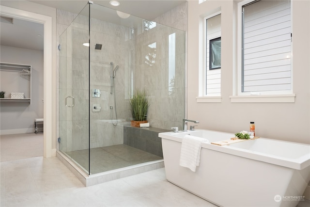 bathroom featuring independent shower and bath and tile patterned floors