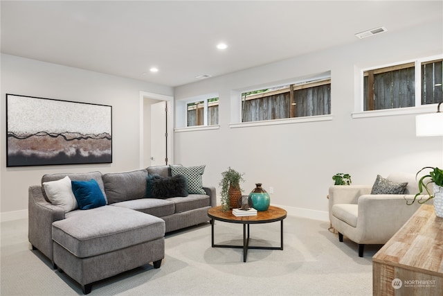 living room featuring light carpet