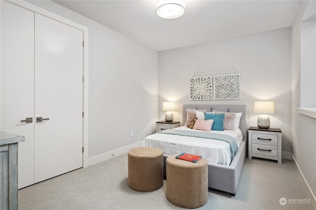 bedroom featuring light colored carpet