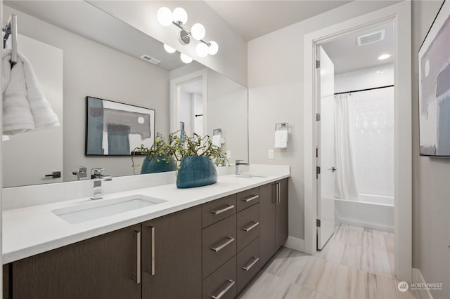 bathroom with vanity and shower / tub combo with curtain