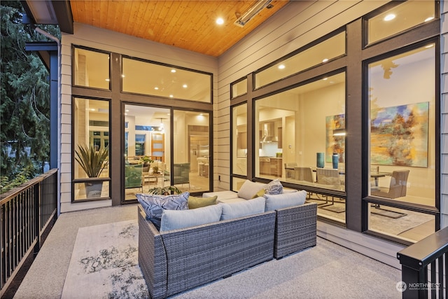 sunroom featuring wooden ceiling