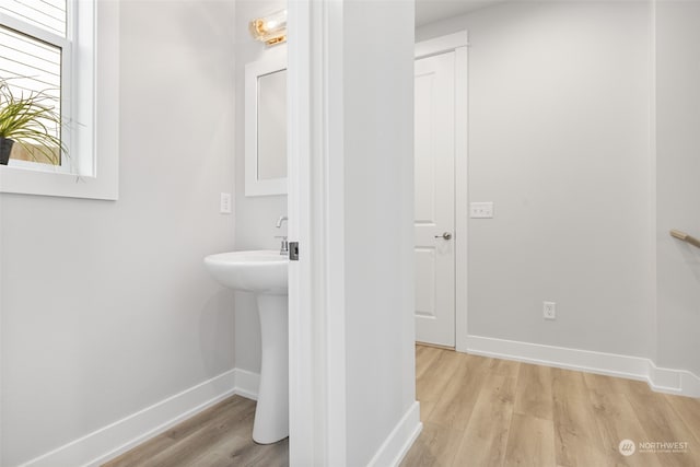 bathroom with hardwood / wood-style flooring