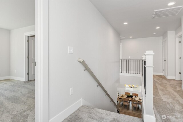 stairway with carpet flooring