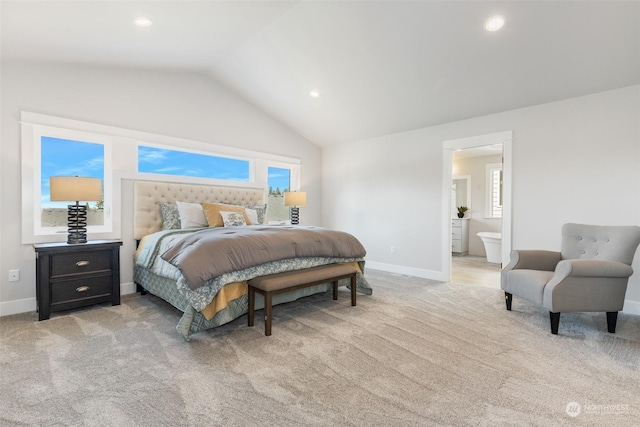 bedroom with baseboards, light carpet, and lofted ceiling